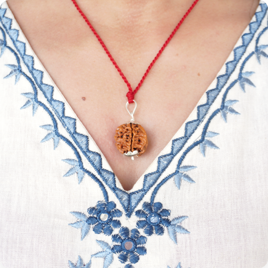 Red Thread Ganesh Mukhi Rudraksha pendant worn by a woman