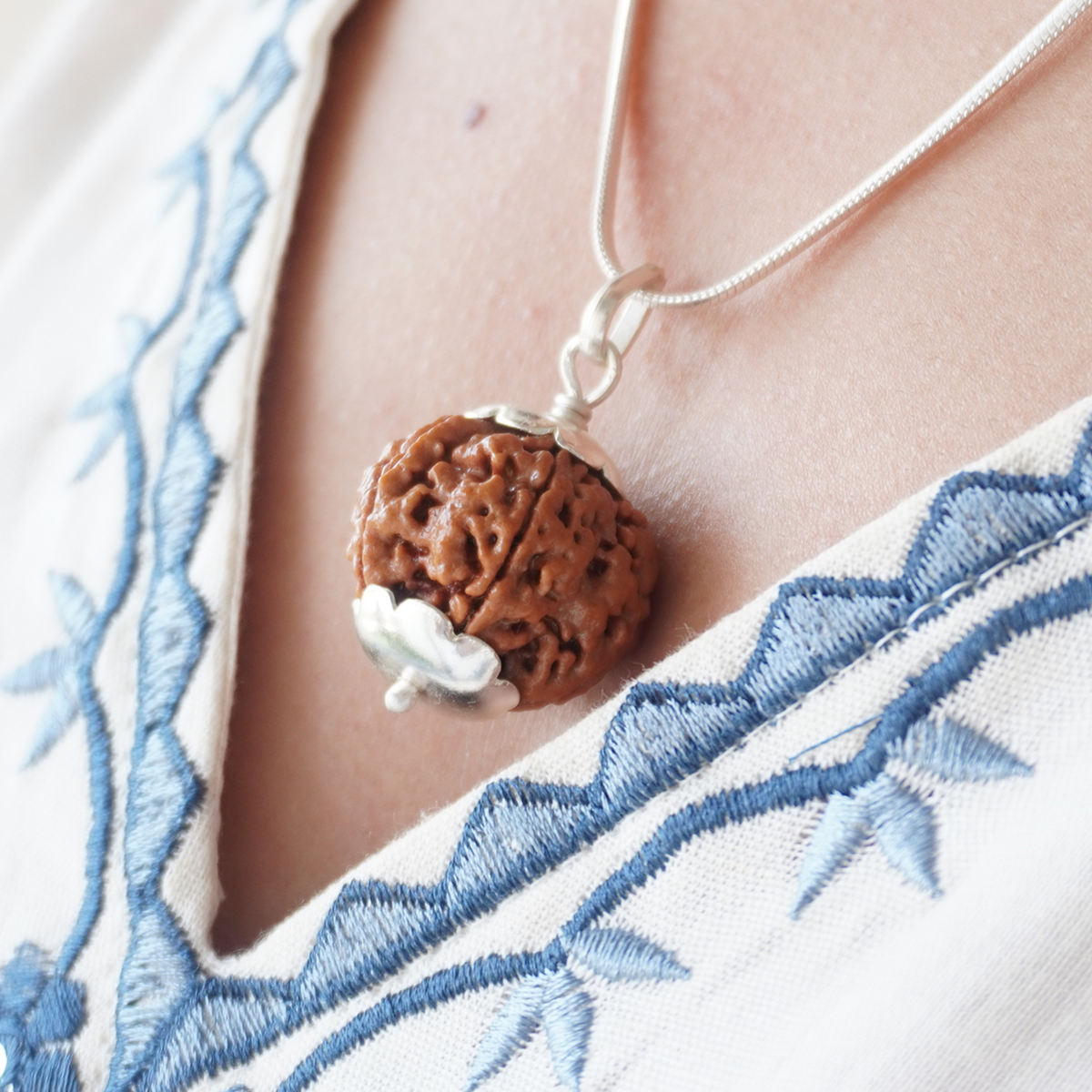 Silver Chain 5 Mukhi Rudraksha pendant worn, close up