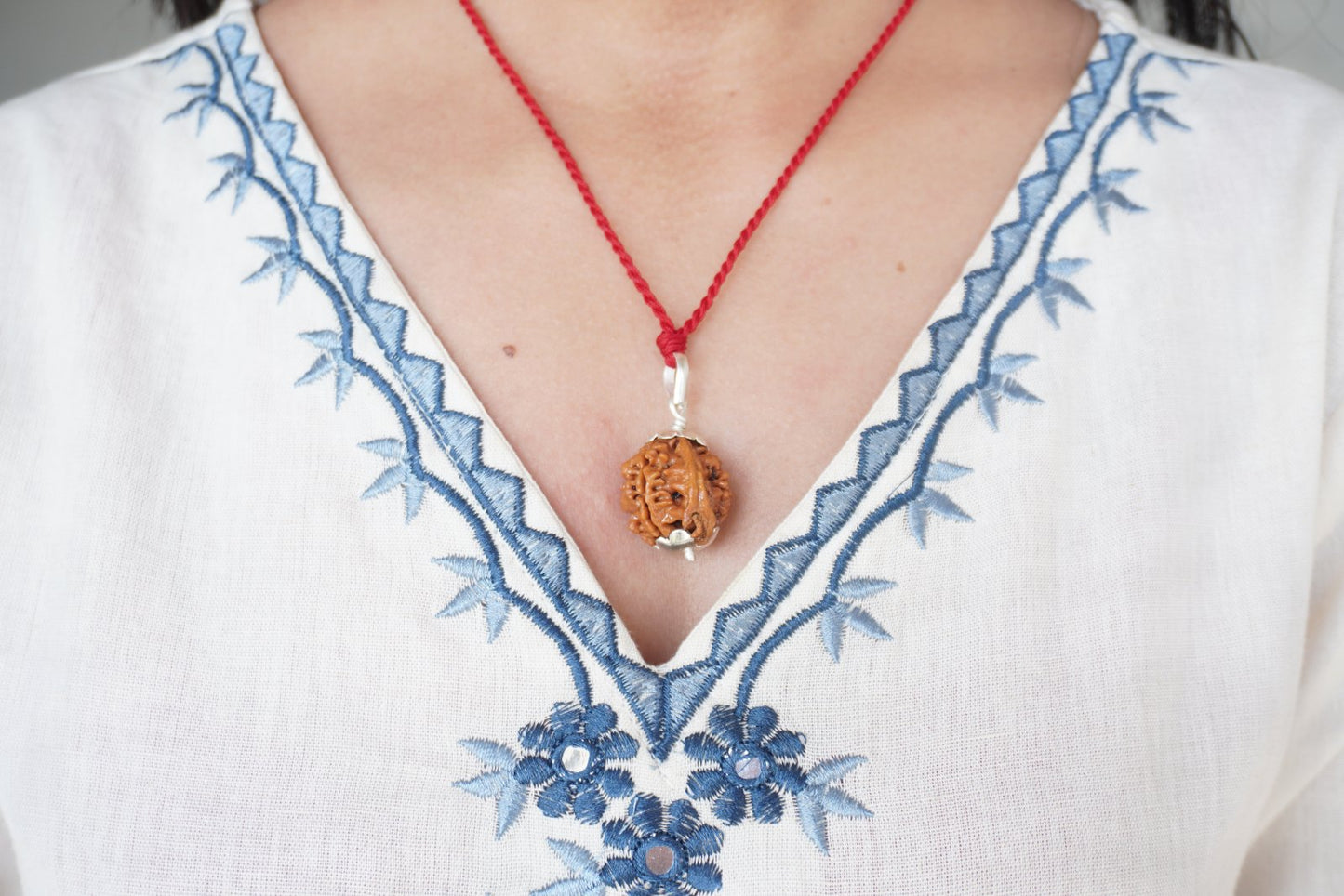 Ganesh Rudraksha pendant on red thread, alternate angle