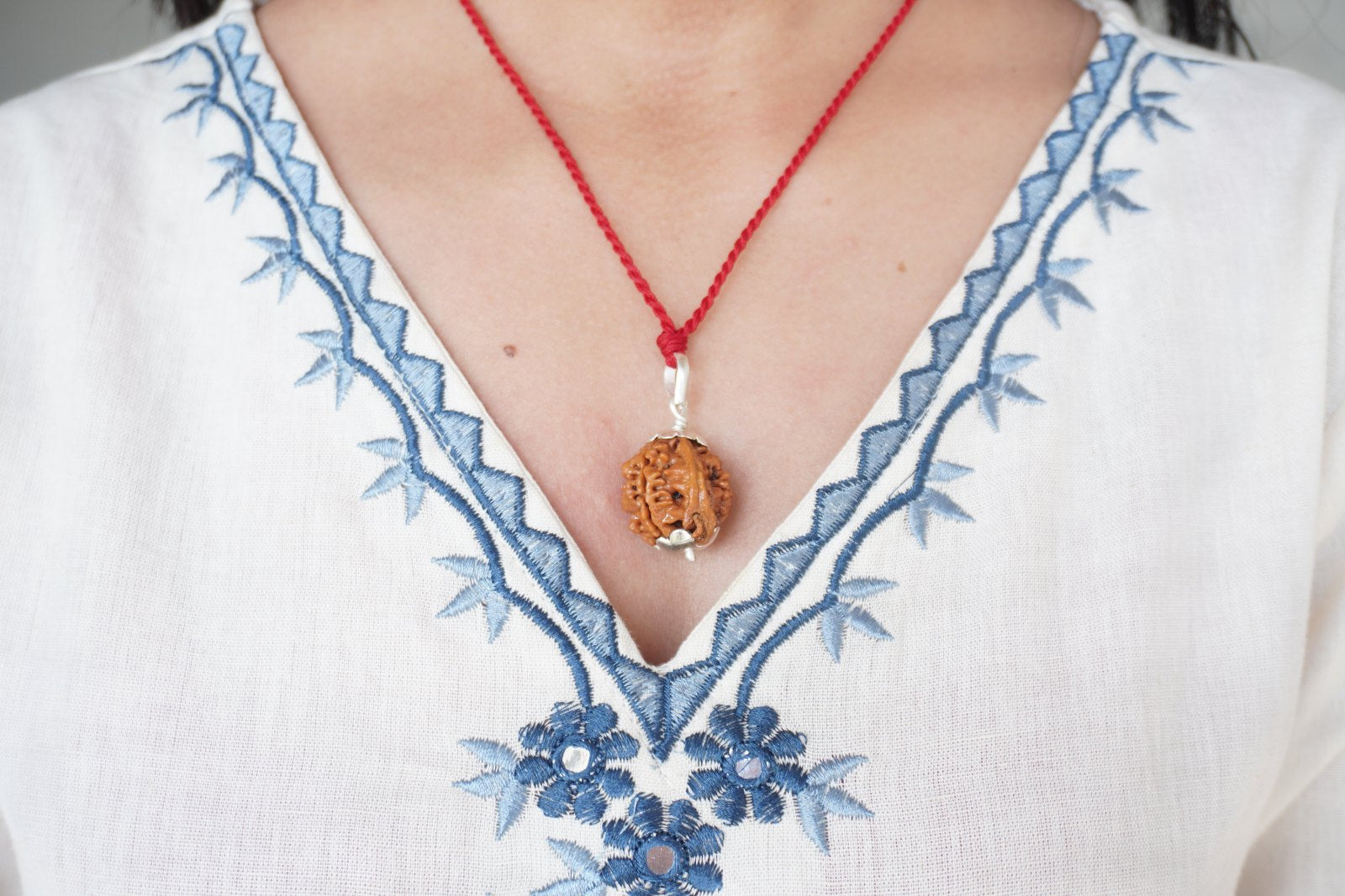 Ganesh Rudraksha pendant on red thread, alternate angle